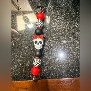 Skull and Bead phone  gripper. Sticks to the back of any phone case. New